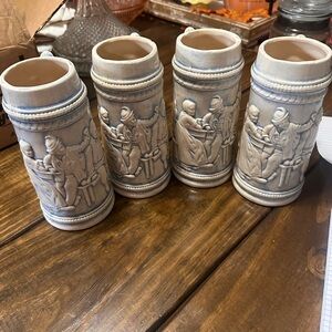 Set of Four Ceramic Mugs with Embossed Design
